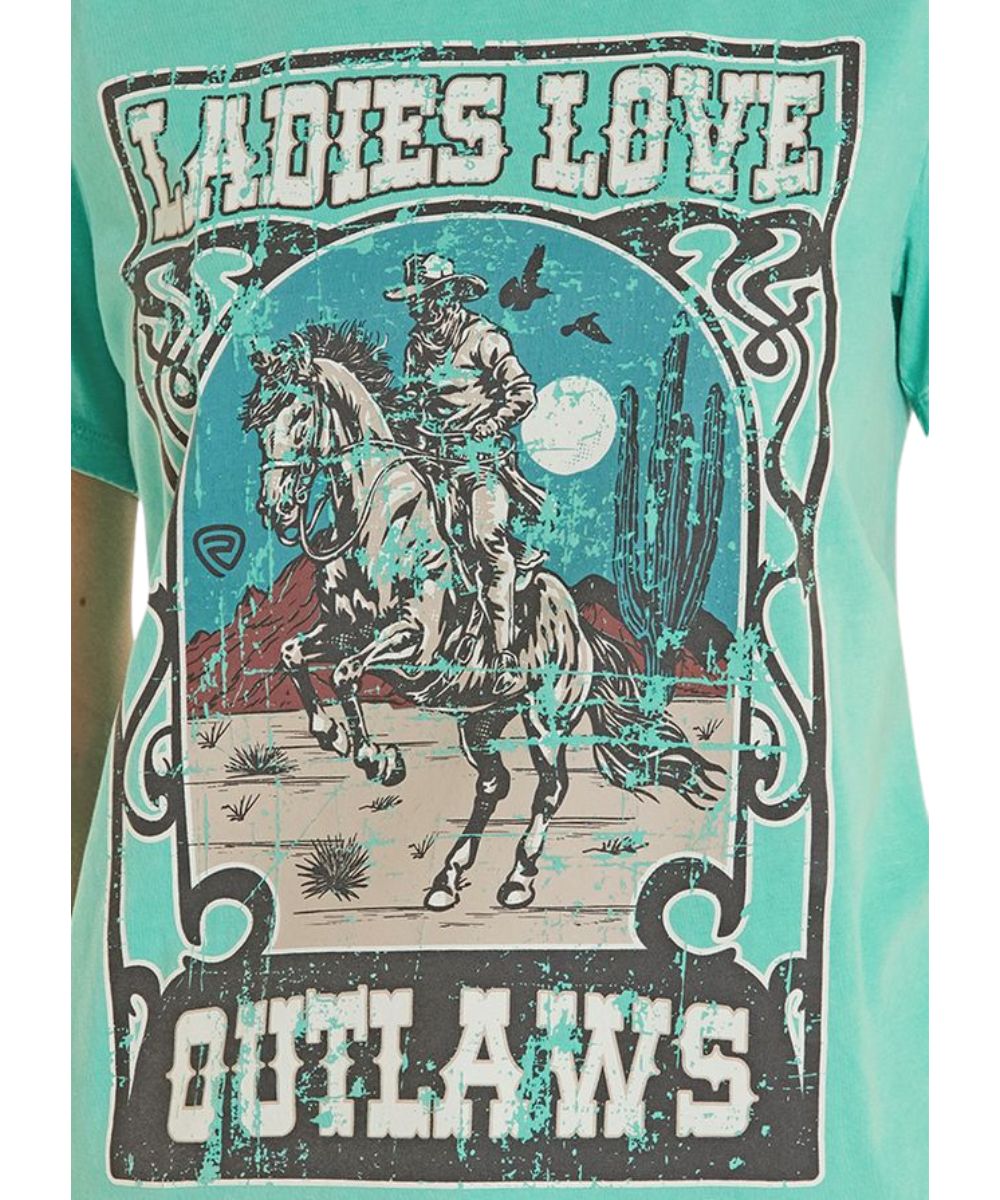 Close-Up View Of The Distressed Outlaw Graphic On A Women's Turquoise Tee