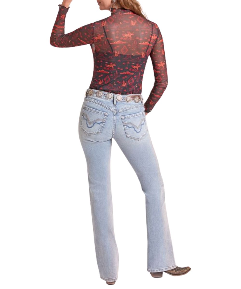 Back view of the women's black long sleeve mesh top featuring the red/orange western desert print, mock collar, and sheer mesh