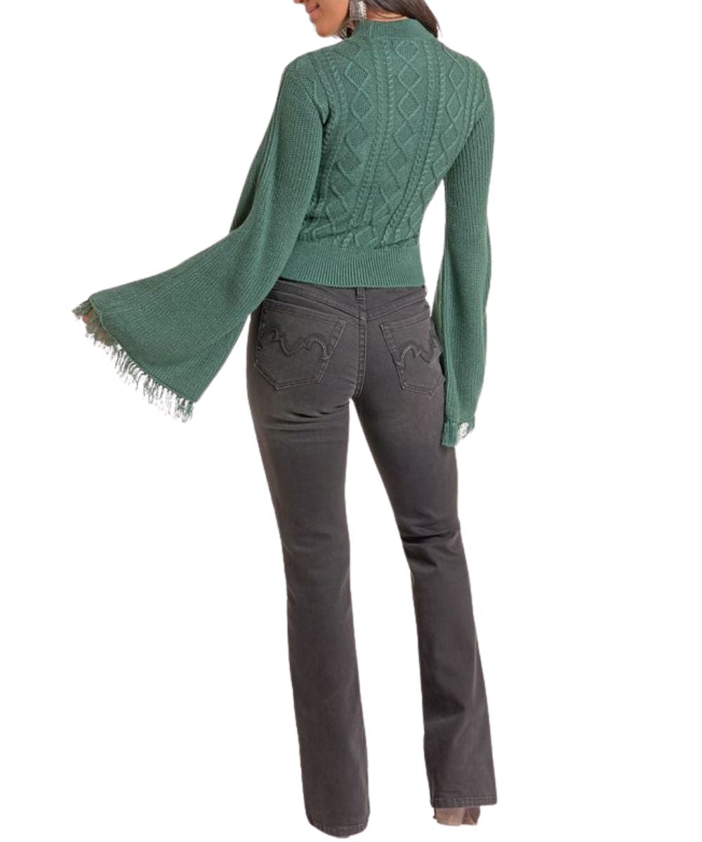 Back view of the women's long sleeve sweater in jade green featuring the cable knit details, rib knit trim, fringed cuffs, and a mock neck
