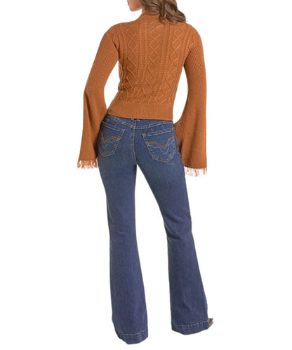 Back view of the women's long sleeve sweater in rust brown featuring the cable knit details, rib knit trim, fringed cuffs, and a mock neck