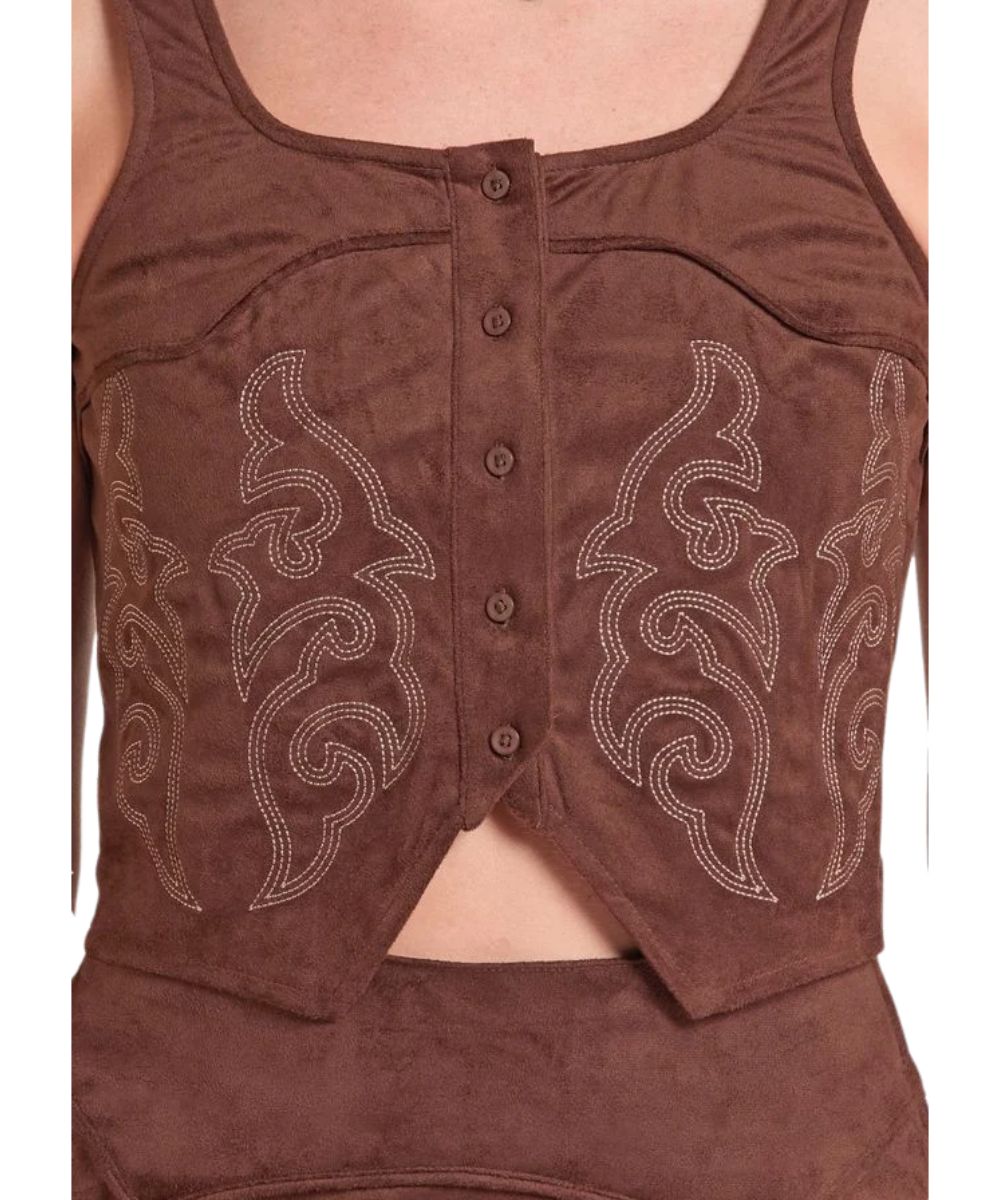 Close-up view of the women's brown suede tank featuring the western boot stitch design in white and curved western yokes