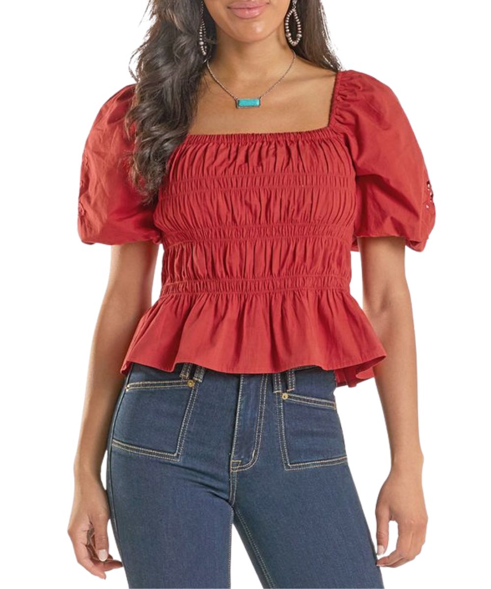 Front view of the women's red blouse featuring a square neckline and short balloon sleeves