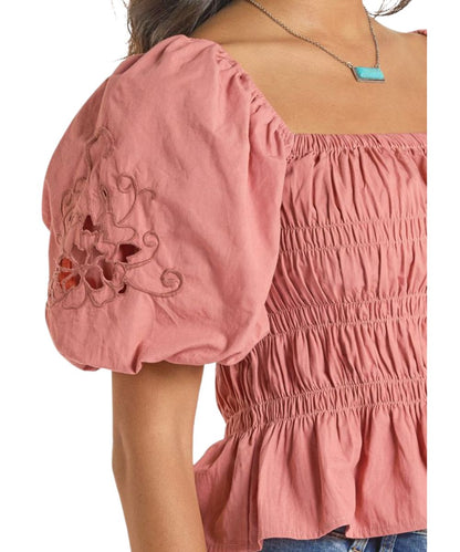 Close-up view of the women's rose/mauve short balloon sleeve blouse with embroidered detailing on the sleeves