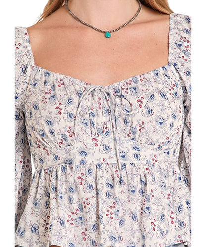 Close-up view of the floral print, self-tie front bow, and elastic trim