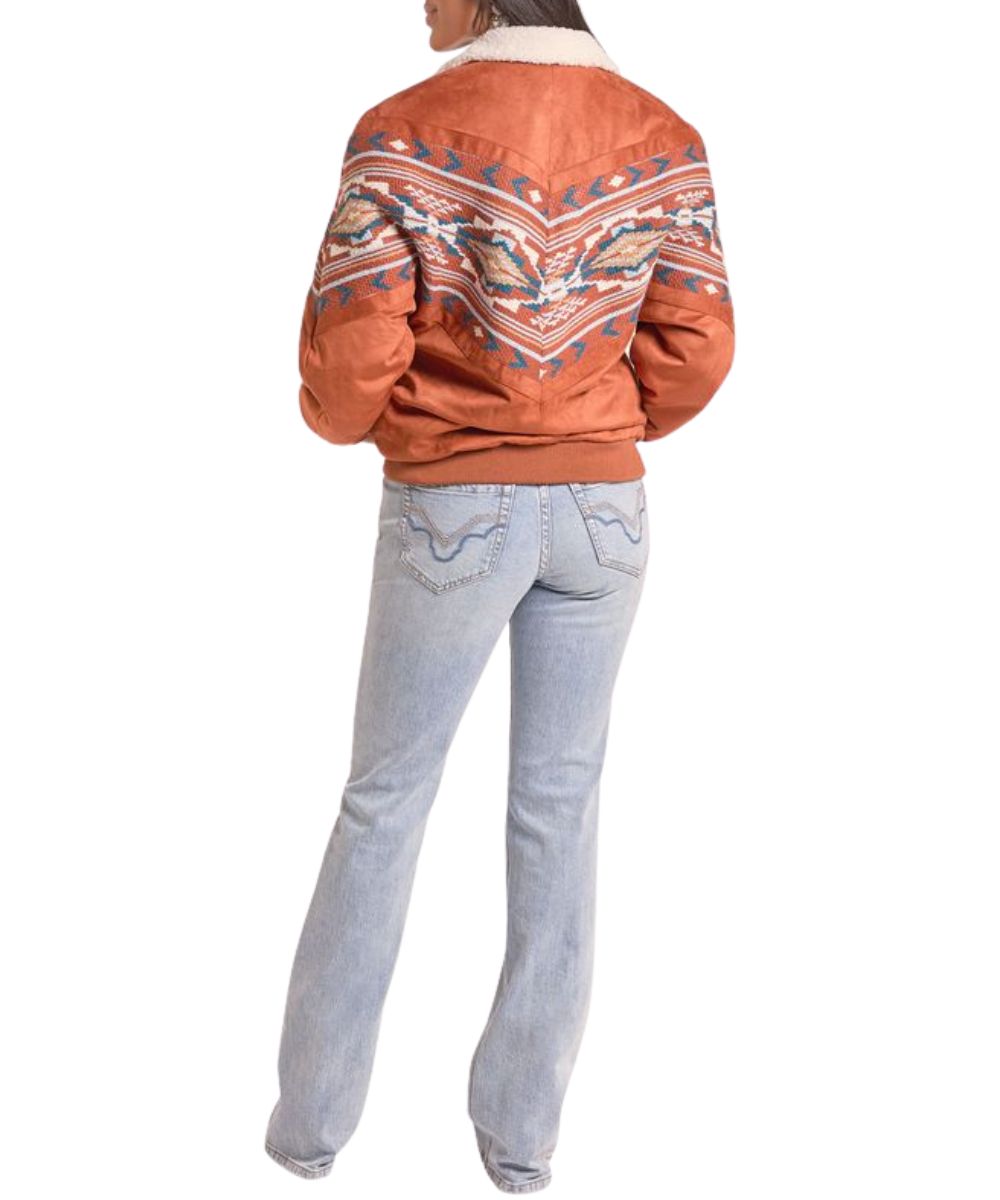 Back view of the women's rust Rock & Roll Cowgirl Aztec Border Print Bomber Jacket featuring the elastic waistband and cuffs