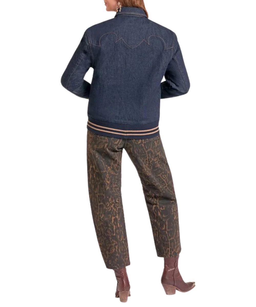 Back view of the women's denim bomber jacket featuring the dark wash, striped hem, and western stitched yokes