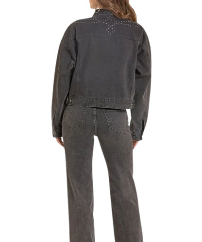 Back view of the women's black denim jacket featuring the studded accents along the straight back yoke and dropped shoulders