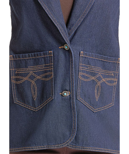 Close-up of a dark blue denim vest with two front pockets featuring decorative contrast stitching and turquoise-colored decorative button details.