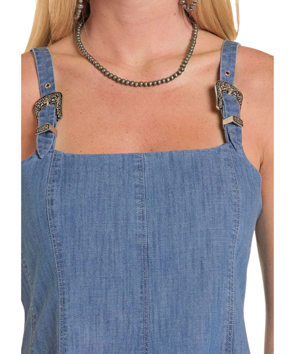 Close-up view of square neckline and adjustable buckle shoulder straps