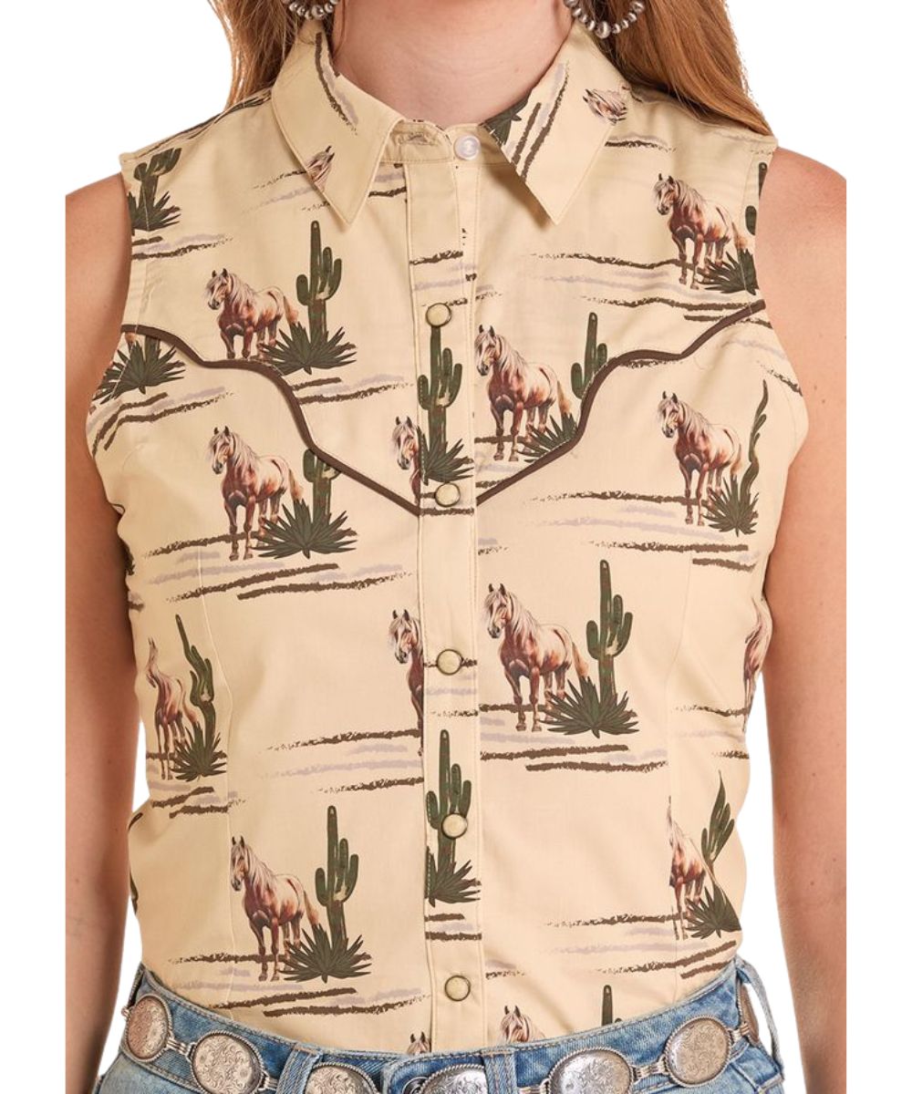Close-Up View Of The Women's Brown Sleeveless Snap Shirt With A Spread Collar And Curved Front Yokes With Brown Piping