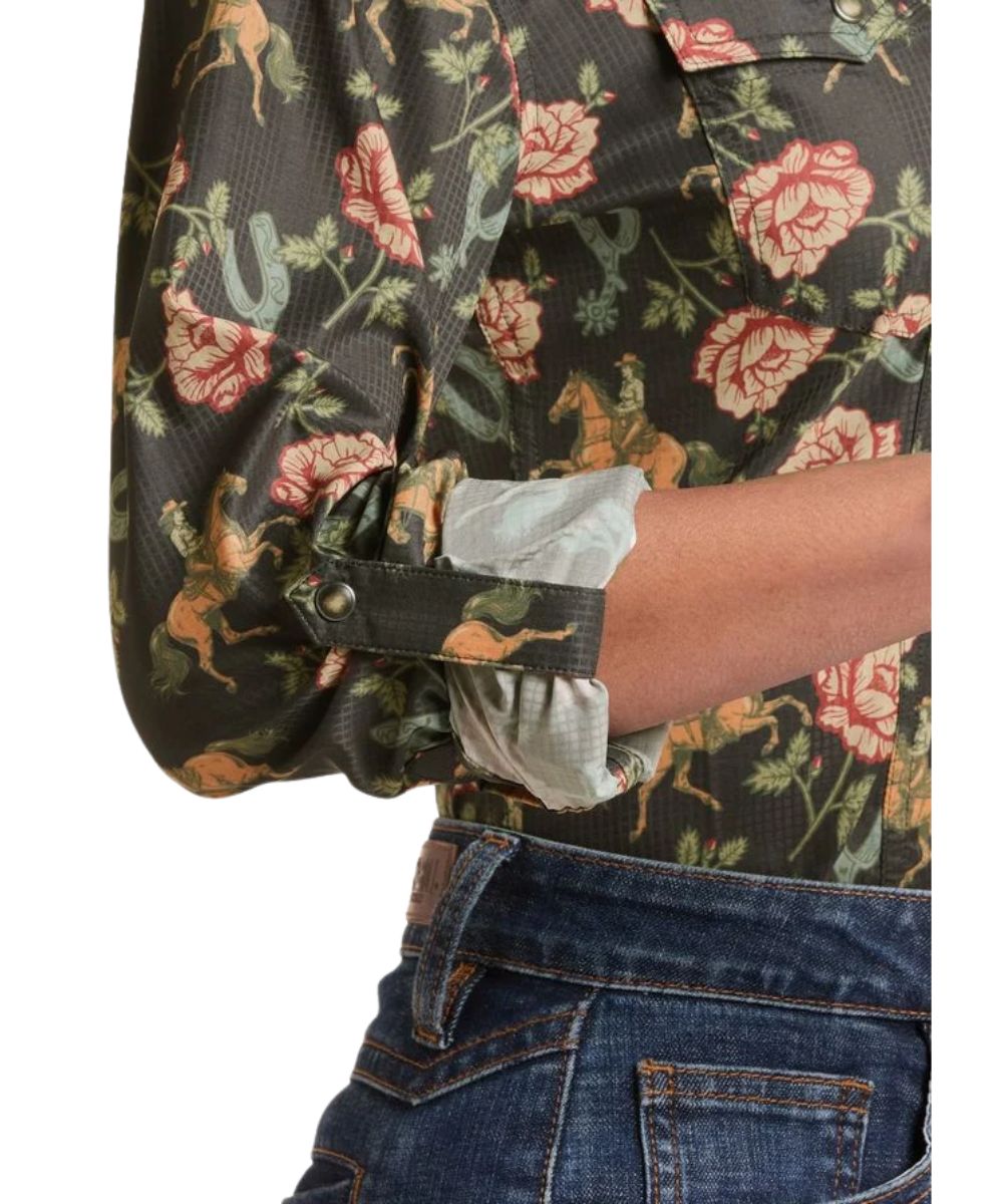 Close-up view of the women's black long sleeve western snap shirt featuring the roll tab at the cuffs to easily roll up sleeves