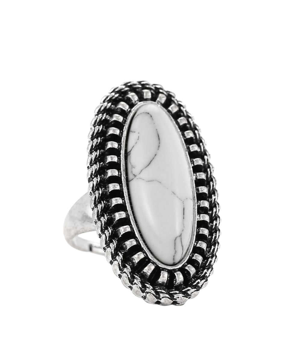 silver tone ring with white center stone