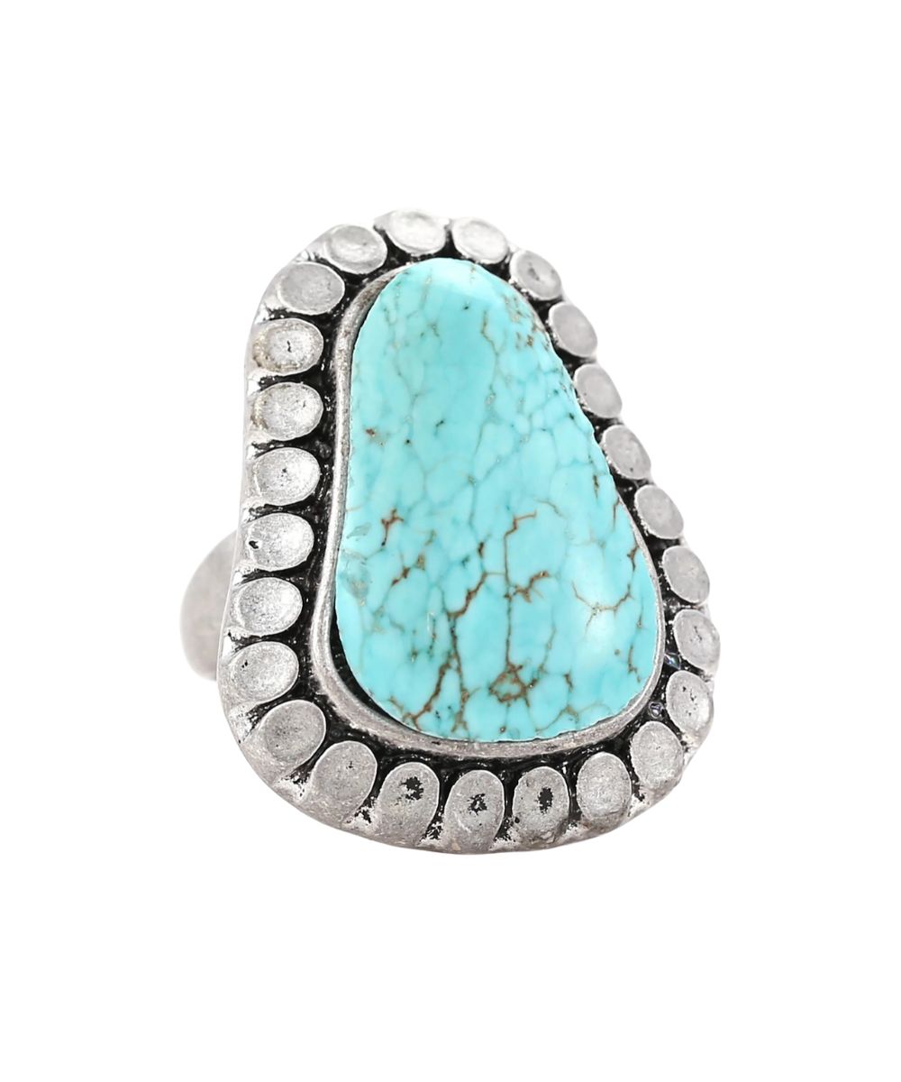Women's Cowgirl Confetti silver ring featuring an adjustable band and howlite turquoise center stone