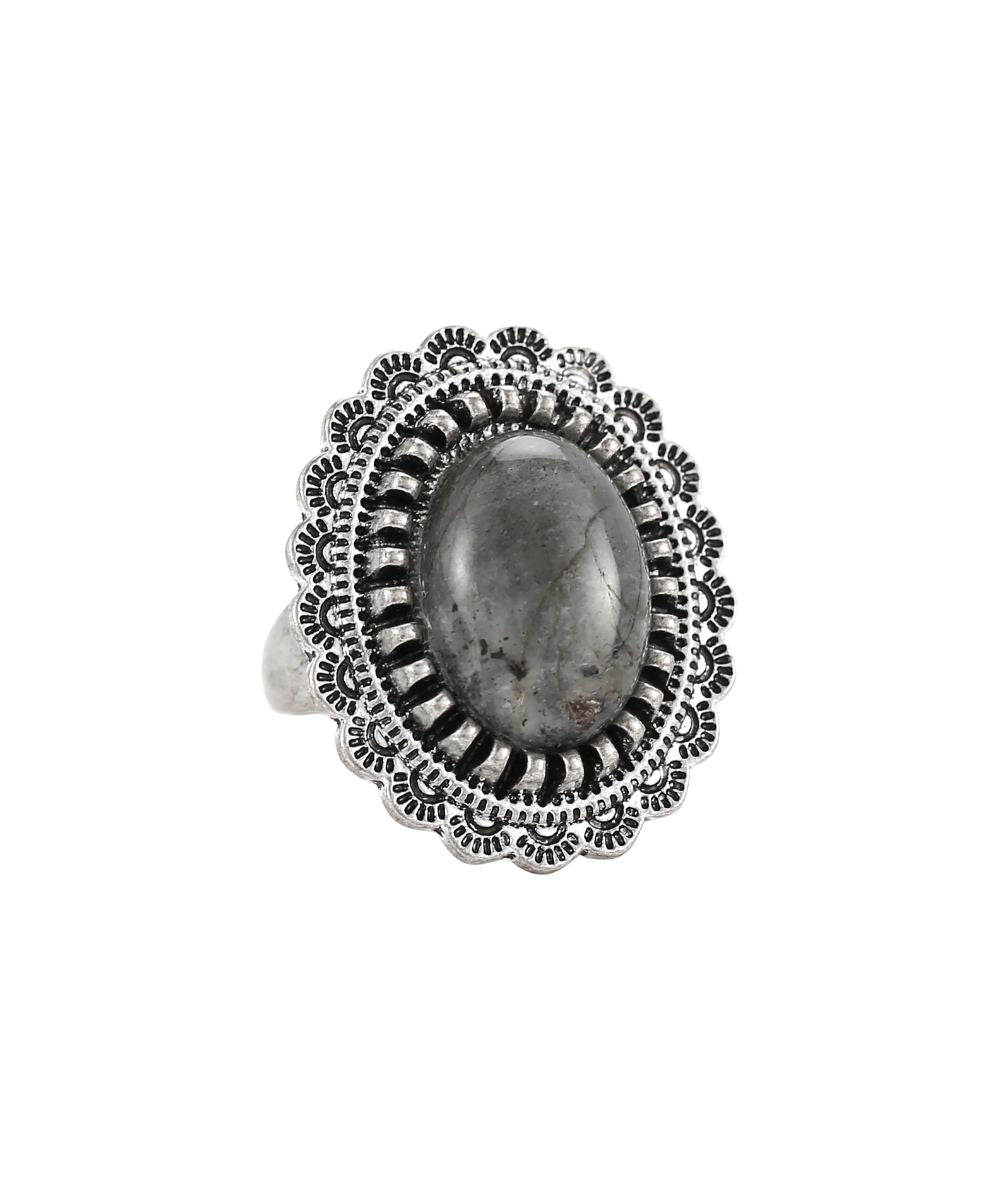 Cowgirl Confetti women's silver ring featuring the labradorite oval centered stone with a flowered edge setting, this ring features an adjustable band