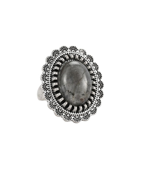 Cowgirl Confetti women's silver ring featuring the labradorite oval centered stone with a flowered edge setting, this ring features an adjustable band