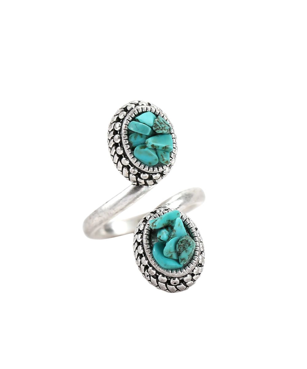 Silver ring with turquoise stones on a white background