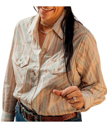 Front view of the women's beige Ely Cattleman long sleeve snap shirt featuring the loose fit with extra length, pearl snaps, spread collar, chest pockets, and turquoise buckstitch print