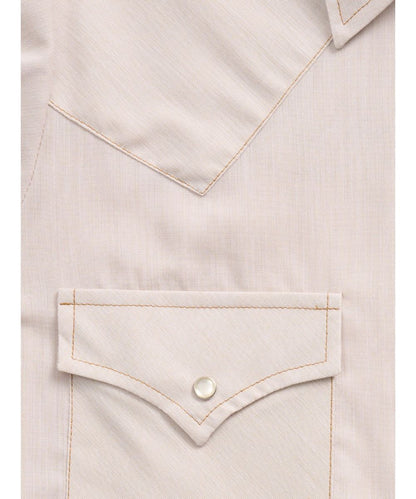 Close-up fabric view of the women's shirt featuring single point snap flap chest pockets, ecru snaps, and single point western yokes
