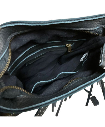 Interior view of the women's black Pranee bag featuring the 1 interior zip pocket and 1 interior slip pocket
