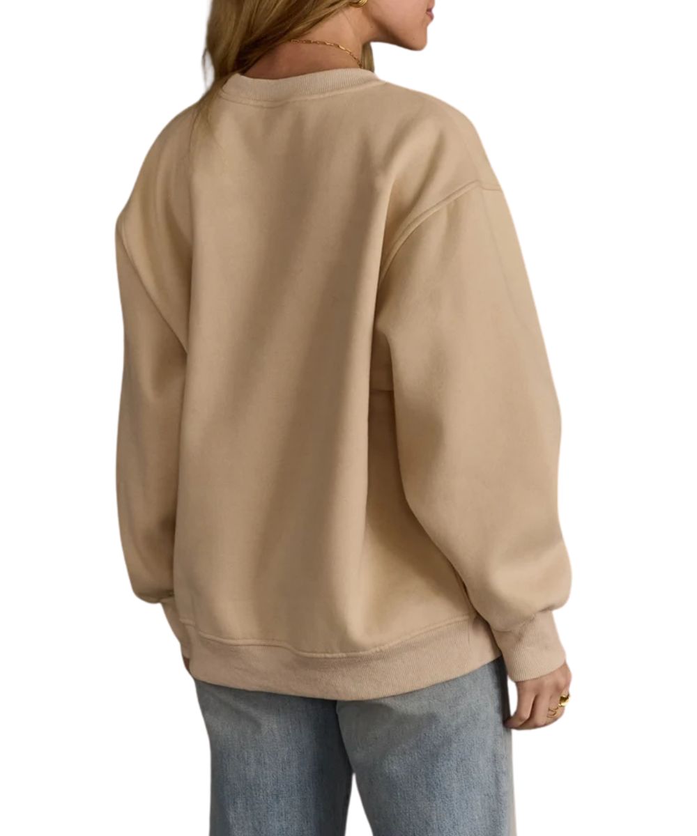 Back view of the women's long sleeve crew sweatshirt featuring the beige color and oversized fit