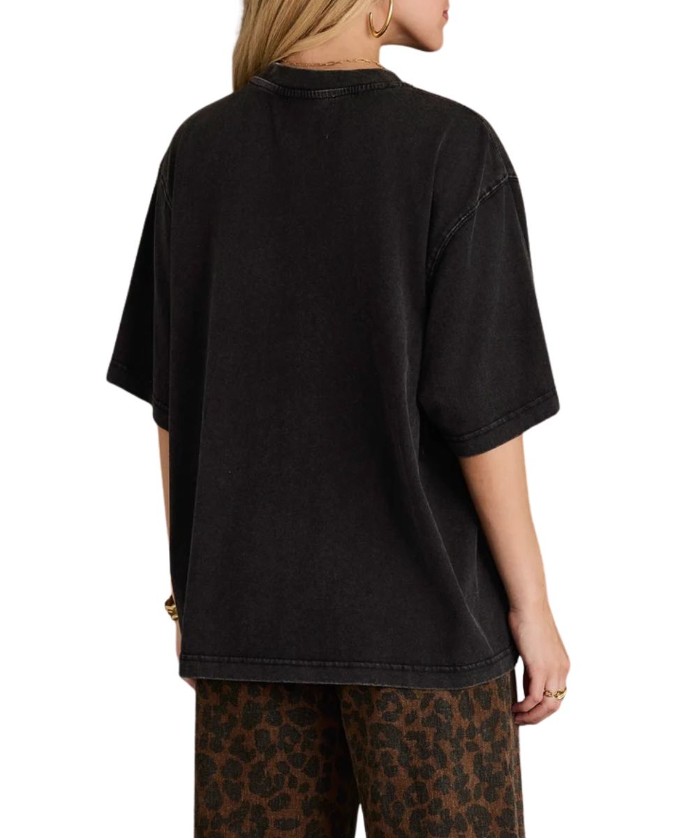 Back view of the women's washed black oversized graphic tee