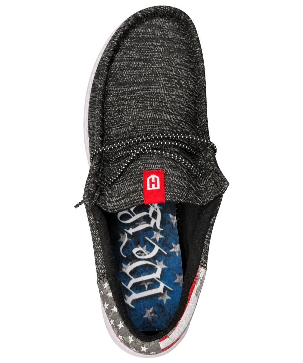 Aerial view of the men's pitch black slip-on casual shoe featuring the round moc toe and lightweight, breathable construction