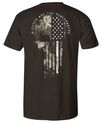 Back view of the men's java black Howitzer graphic tee featuring the camo American Flag skull graphic that reads: "Blessed Are The Peacemakers"