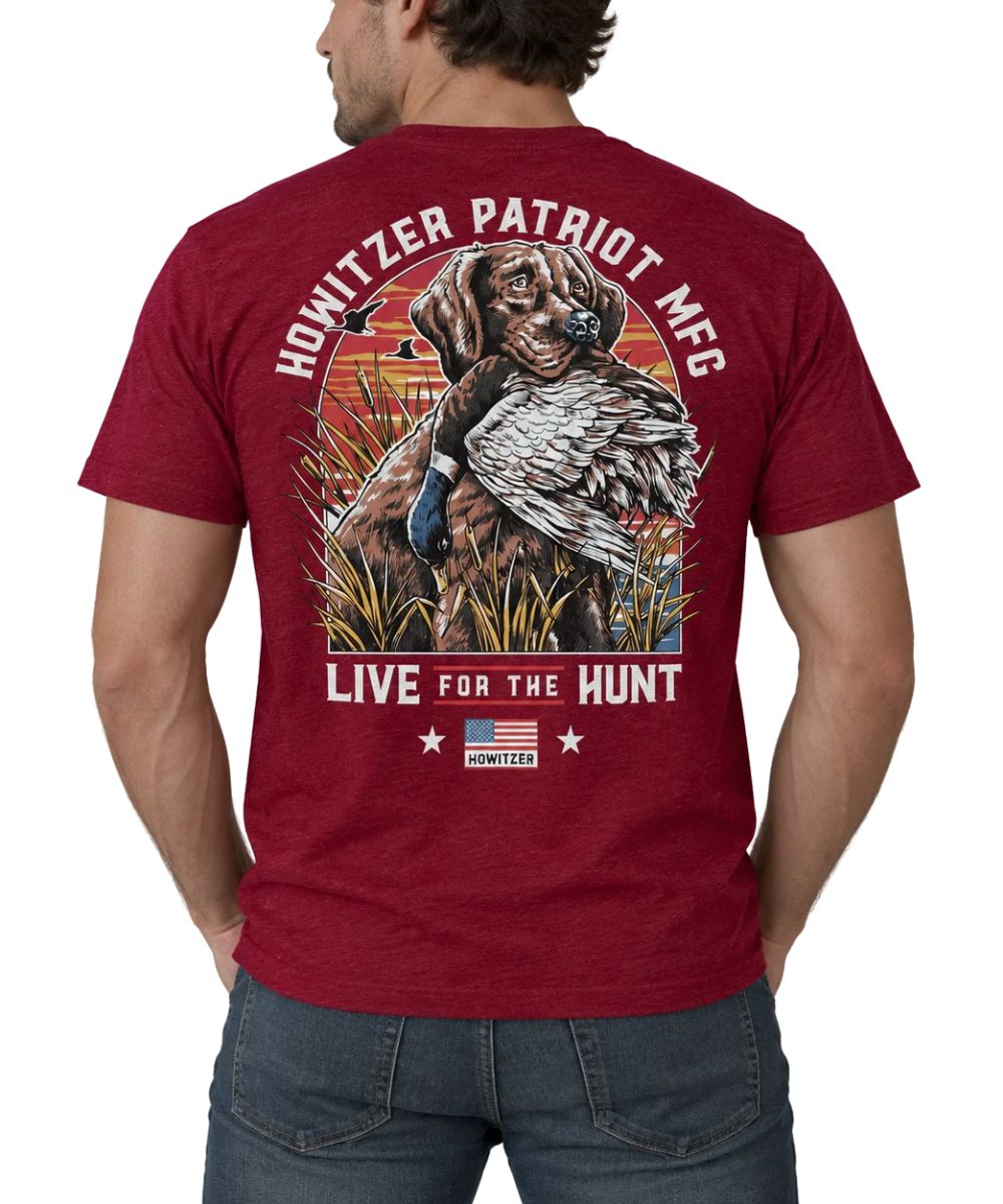 Man from the back wearing a maroon shirt with a picture of a hunting dog with a  duck in its mouth. The words "HOWITZER PATRIOT MFG" and "LIVE FOR THE HUNT"