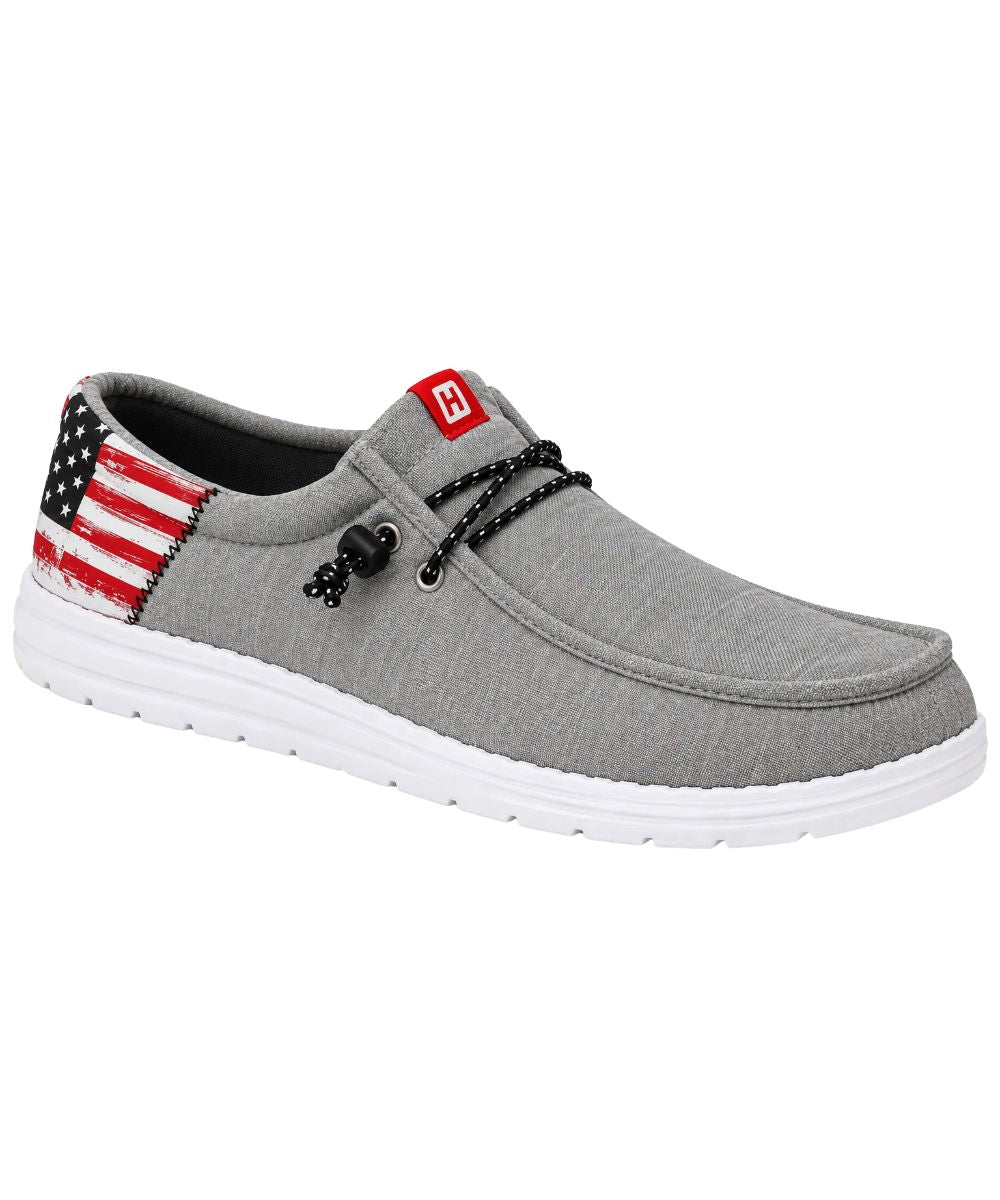 Right angled view of the men's grey Howitzer roam flag shoe featuring the grey fabric upper with an easy slip-on entry, and adjustable elastic laces