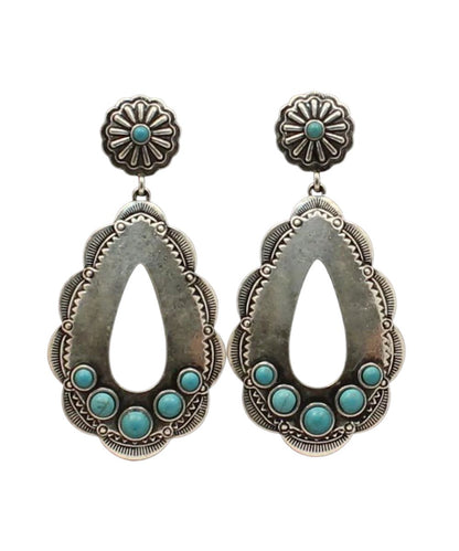 silver dangle earrings with faux turquoise stones on a white background