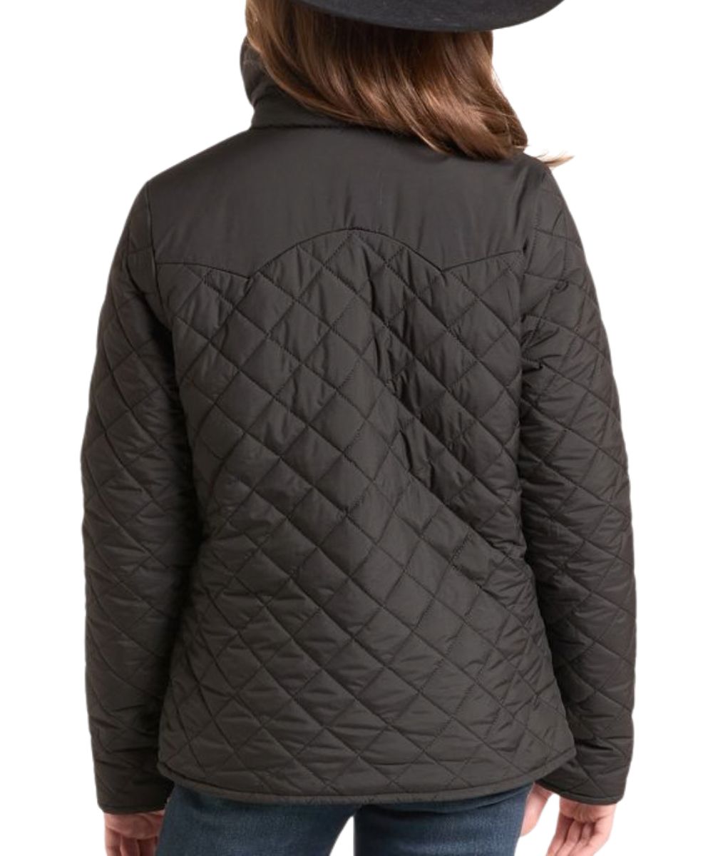 Back view of the girl's black quilted jacket reversed from the wine jacket featuring the double pointed back yoke