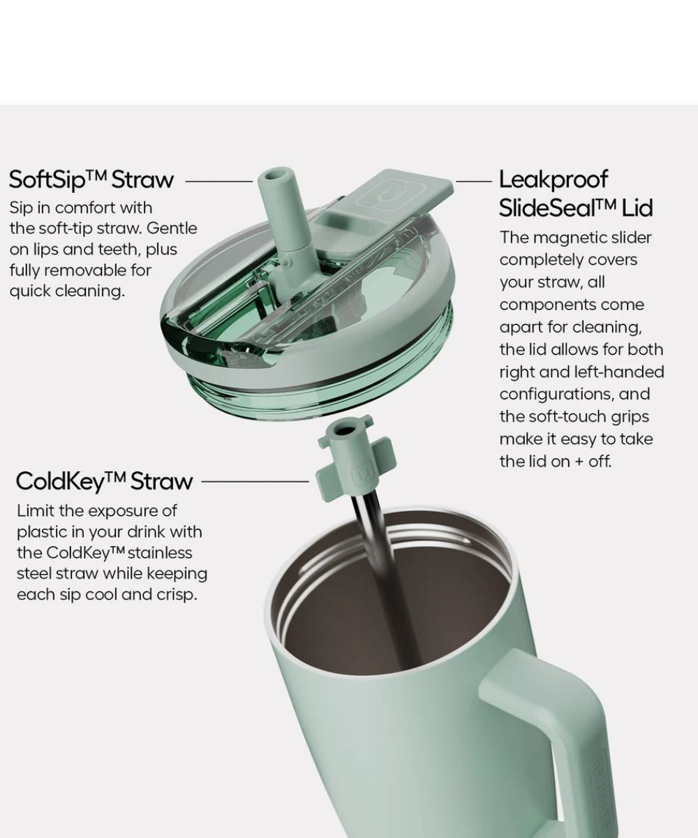A mint green insulated travel tumbler with a transparent lid and straw, shown with callout labels and arrows explaining the Soft Sip Straw, Leakproof SlideSeal Lid, and ColdKey™ Straw features.