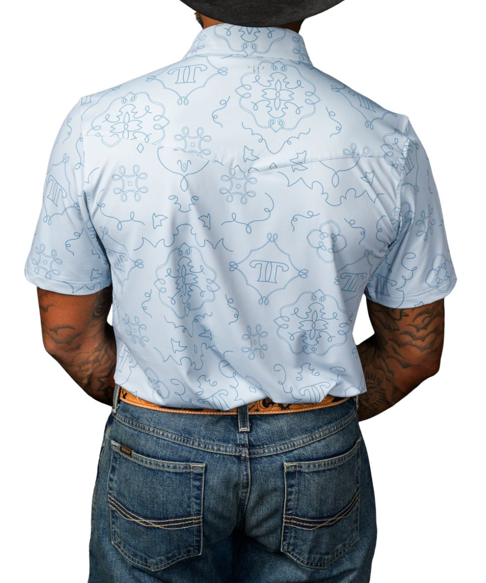 Back view of the men's light blue geometric print polo shirt featuring a single point back yoke