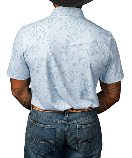 Back view of the men's light blue geometric print polo shirt featuring a single point back yoke