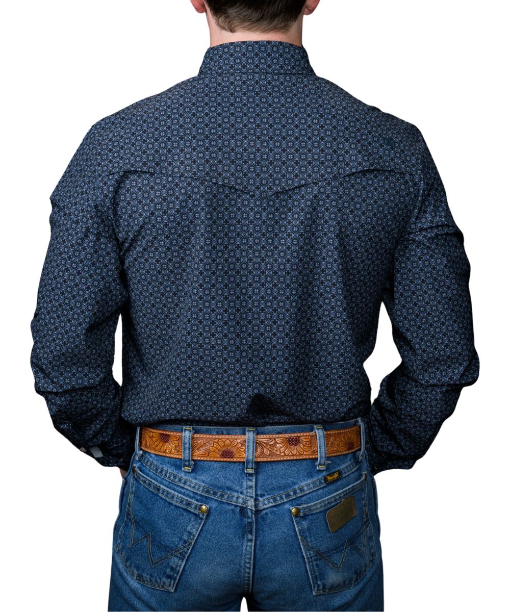 Back view of man wearing a men's black long sleeve pearl snap shirt with blue geometric print and vented back yoke