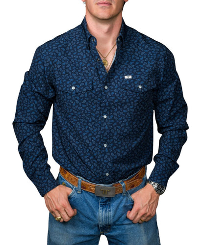 Front view of the men's navy Ferrell Brand long sleeve pearl snap shirt featuring the hidden snap down collar, chest pockets, paisley print, and wrinkle resistance