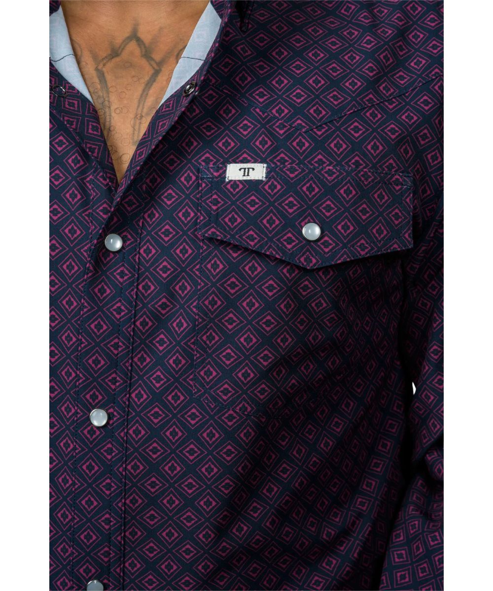 Close-up view of the geometric print and pearl snaps