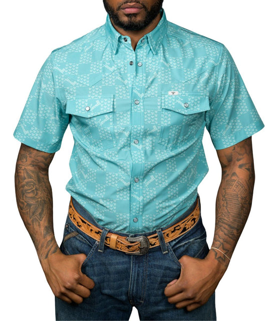 Front view of the men's short sleeve green pearl snap shirt featuring a geometric logo check print