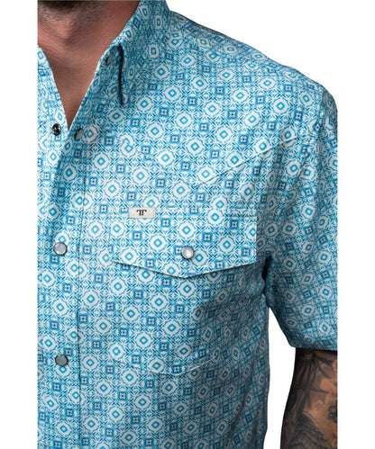 Close-up view of the blue geometric print, hidden snap down collar, and pen slot