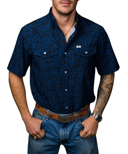 Front view of the men's royal blue Ferrell Brand short sleeve pearl snap shirt featuring the hidden snap down collar, chest pockets, and western yokes
