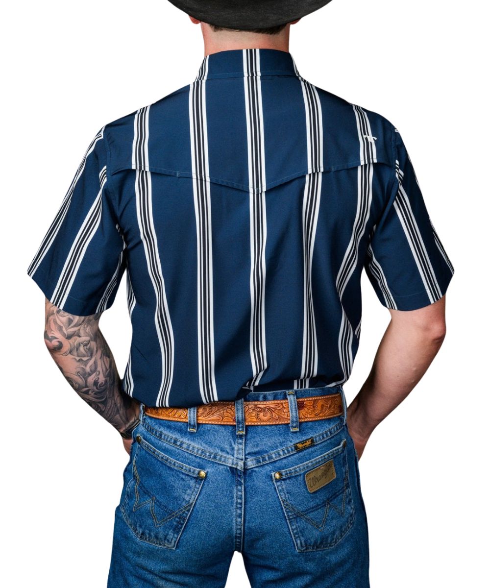 Back view of the men's navy blue short sleeve pearl snap shirt featuring the white vertical stripes and a single point vented back yoke 