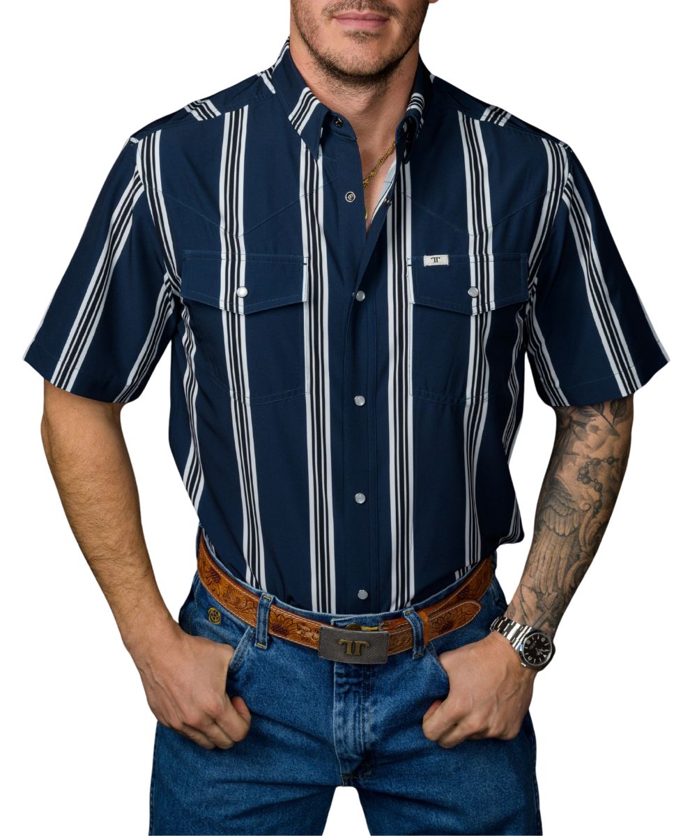 Front view of the men's navy blue Ferrell Brand short sleeve snap shirt featuring the bold white vertical striped print, pearl snaps, hidden snap down collar, and wrinkle resistance