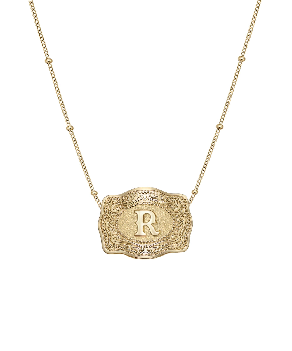 mini gold belt buckle r initial necklace on white background