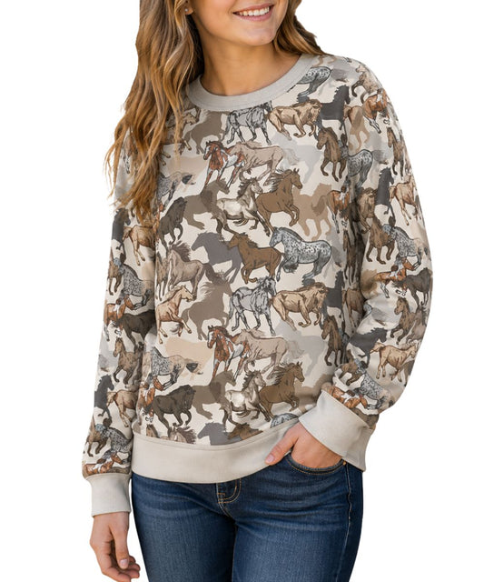 Model view of the girl's white long sleeve crew neck pullover featuring the allover horse print design