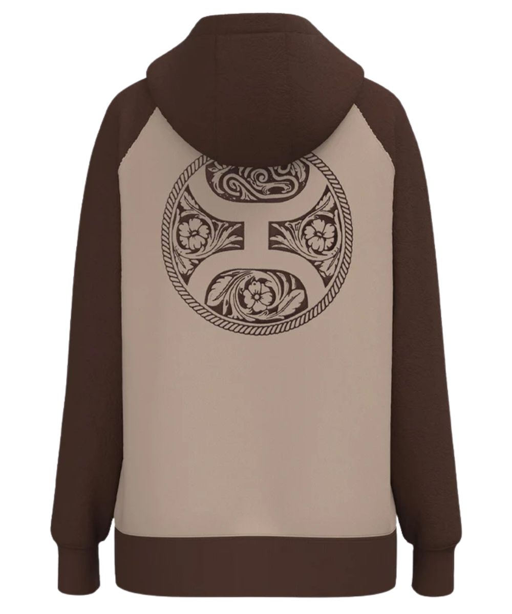 Back view of the women's tan and brown legendary hoodie featuring the  large tooled logo graphic on the back