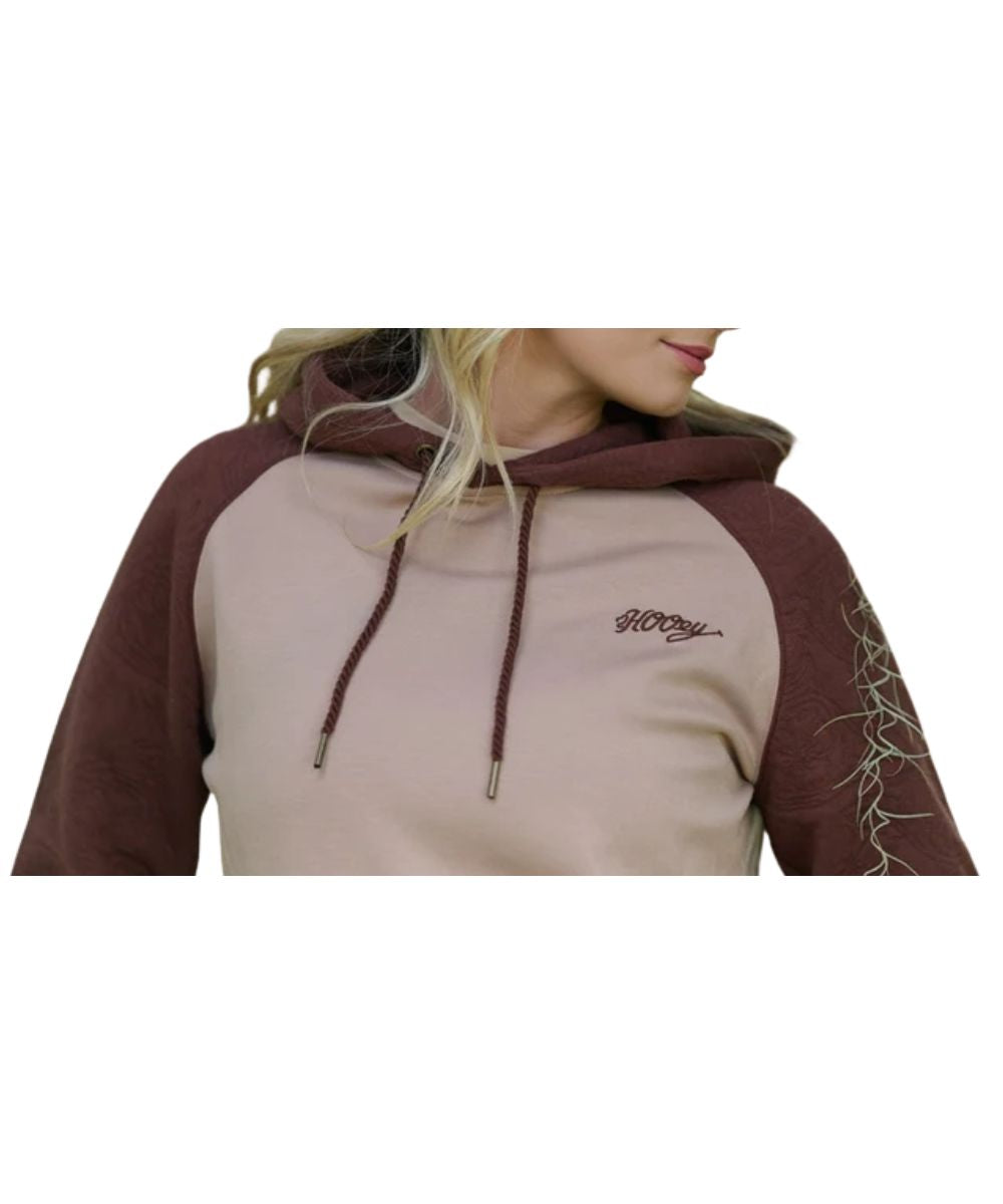 Model view of the women's tan and brown legendary hoodie featuring the logo embroidery on the left chest
