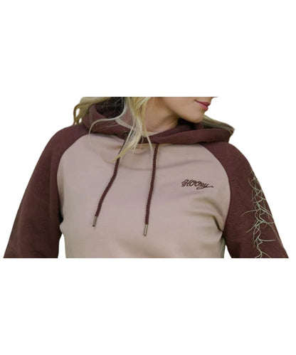 Model view of the women's tan and brown legendary hoodie featuring the logo embroidery on the left chest