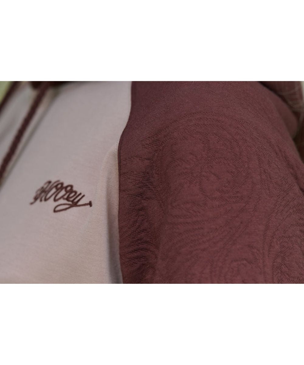 Close-up view of the brown tooled sleeves