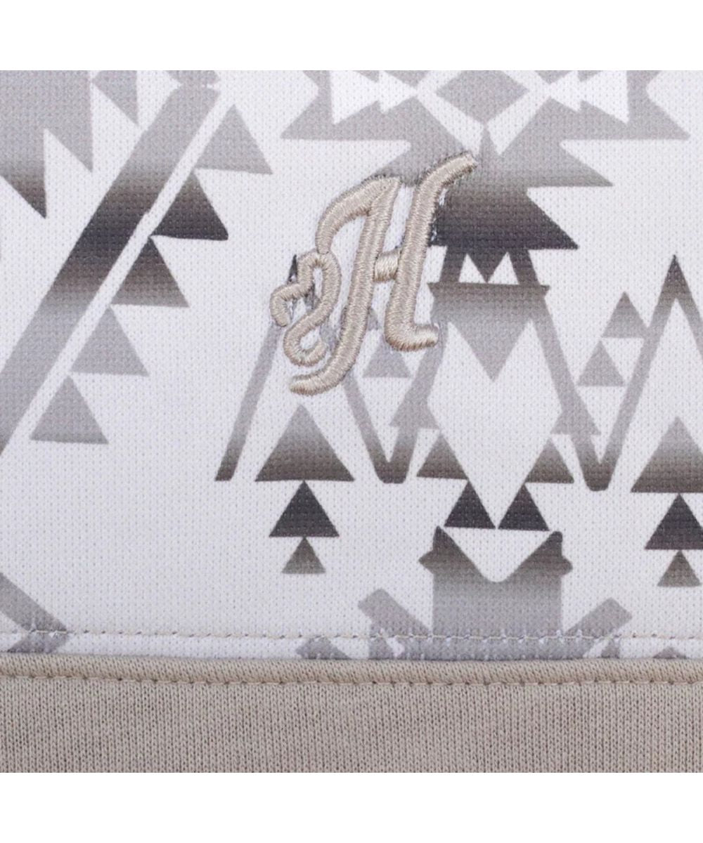 Close-up view of the logo embroidery at the left chest