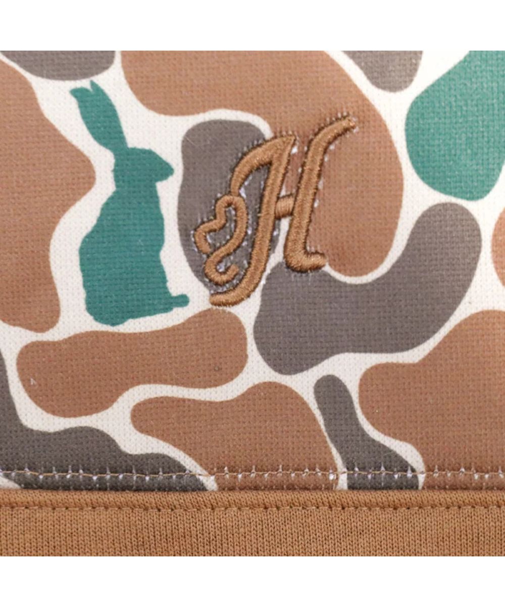 Close-up view of the logo embroidery at the left chest